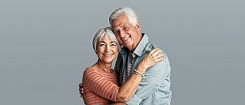 Elderly couple hugging and smiling Elderly couple hugging and smiling