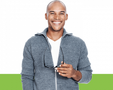 Man in a hoodie holding his glasses Man in a hoodie holding his glasses